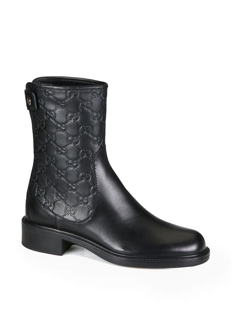 black leather gucci boot embossed gg monogram|gucci boots suede.